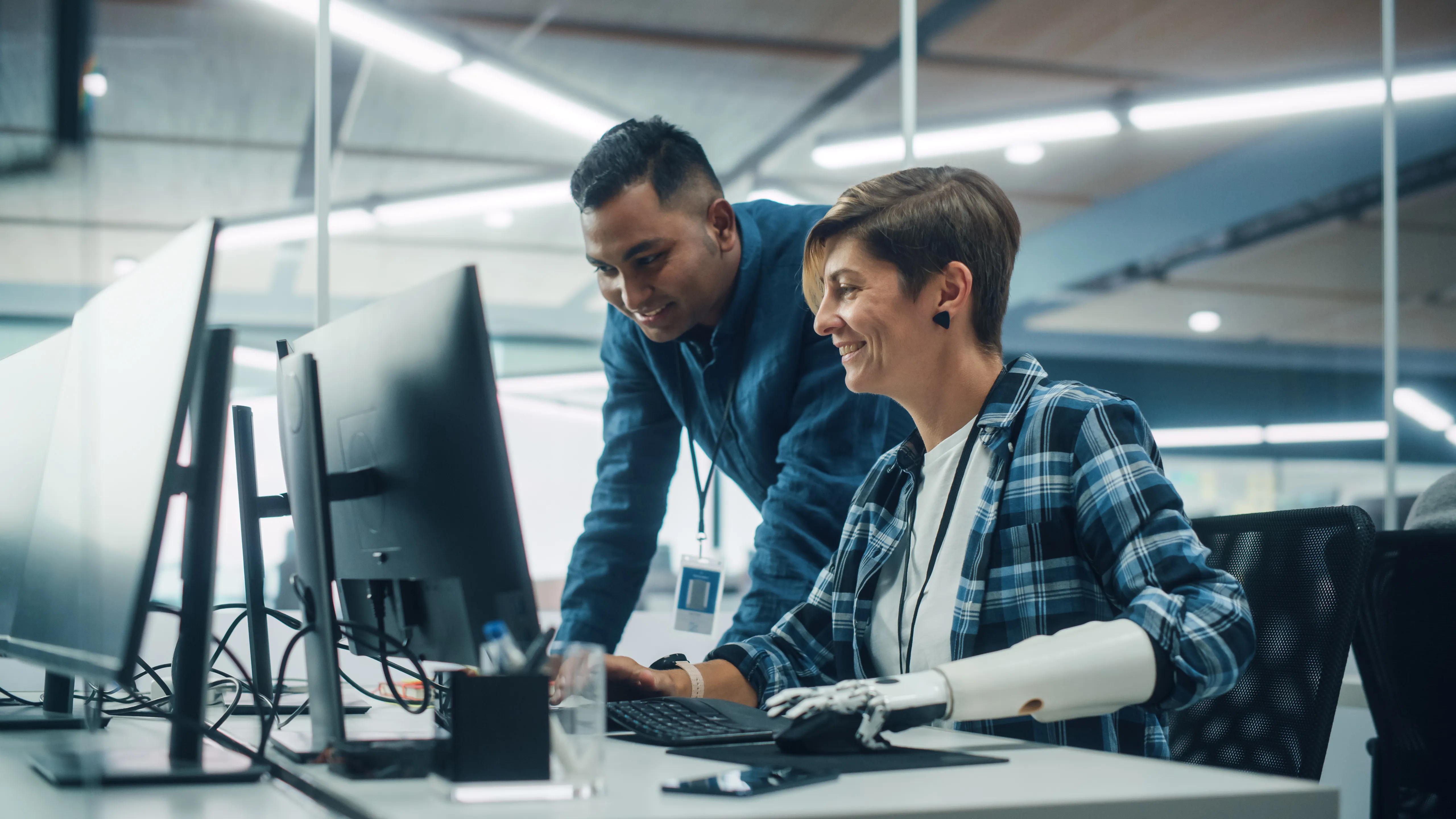 Man and woman looking at computer